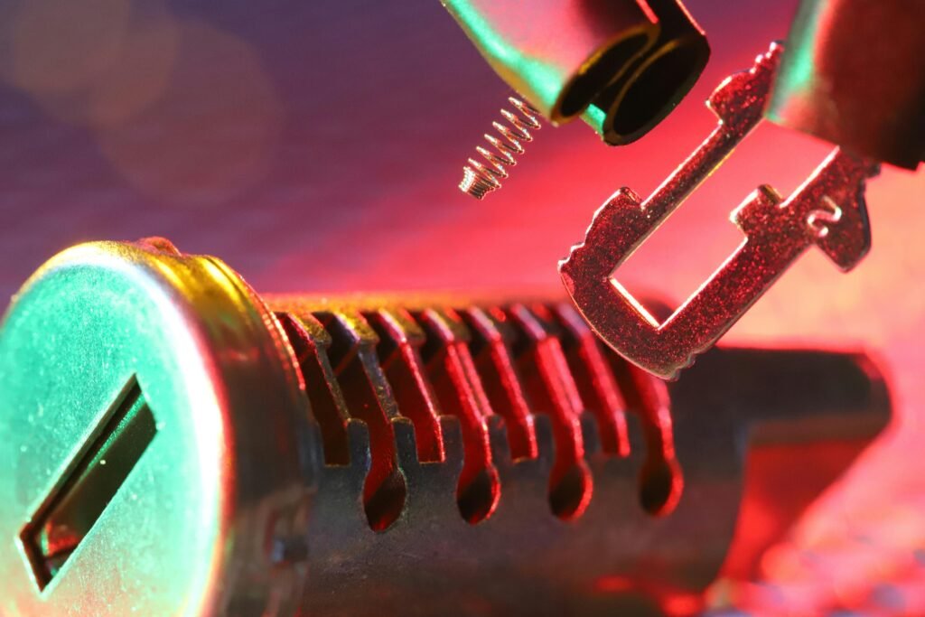 Macro shot of a mechanical lock cylinder and key, highlighting detailed components under vibrant lighting.